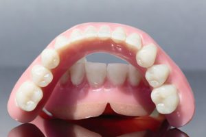 visit your dentist for denture repairs as soon as possible